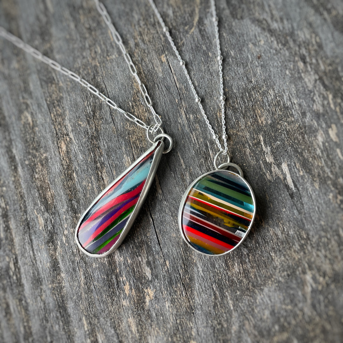 Two striped Surfite & sterling silver pendant necklaces