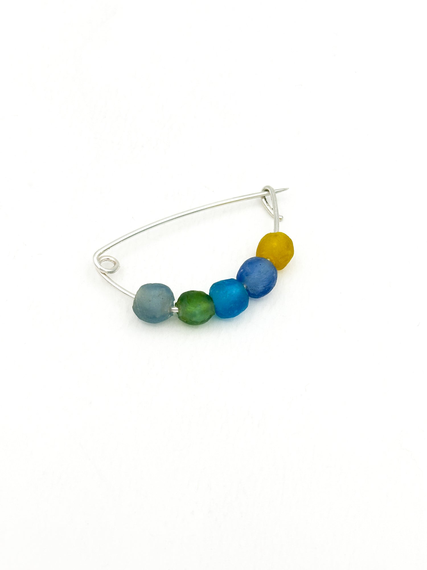 Sterling silver fibula brooch with recycled glass trade beads in blue, green and yellow